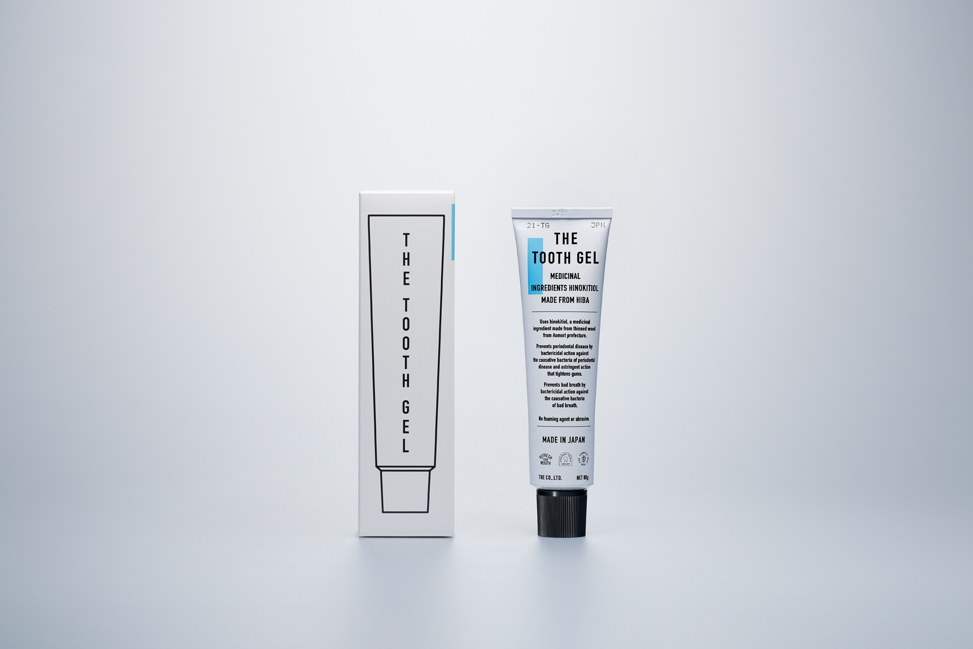 THE TOOTHGEL 牙膏軟管與外盒置於淺灰背景,呈現完整產品包裝。